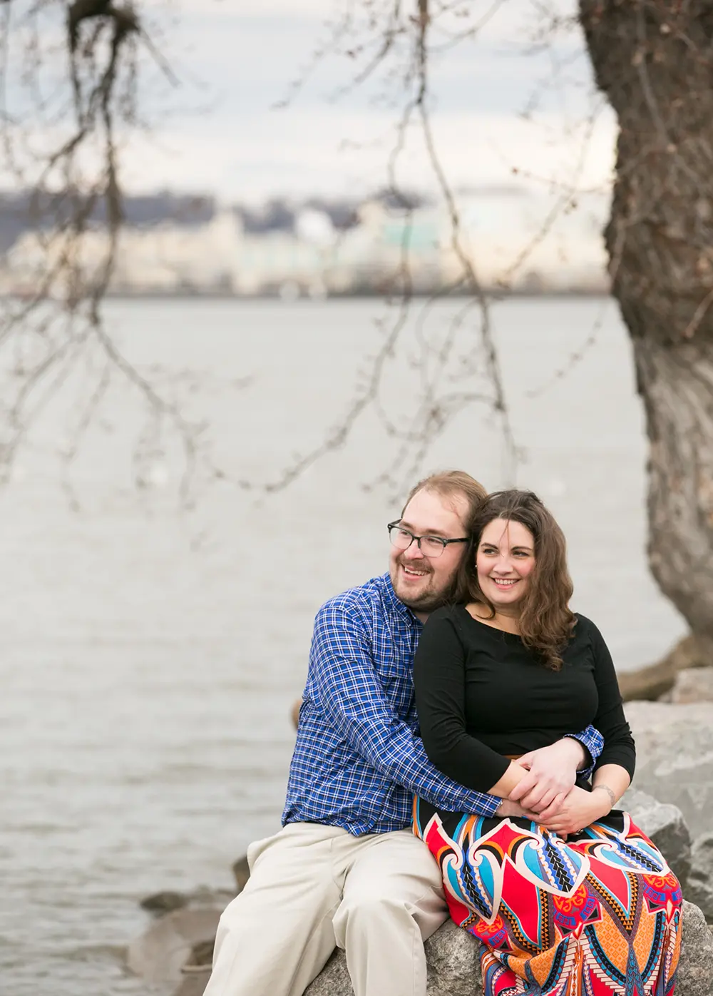 Engaged couple in front of the Potomac River in Old Town Alexandria Engagement